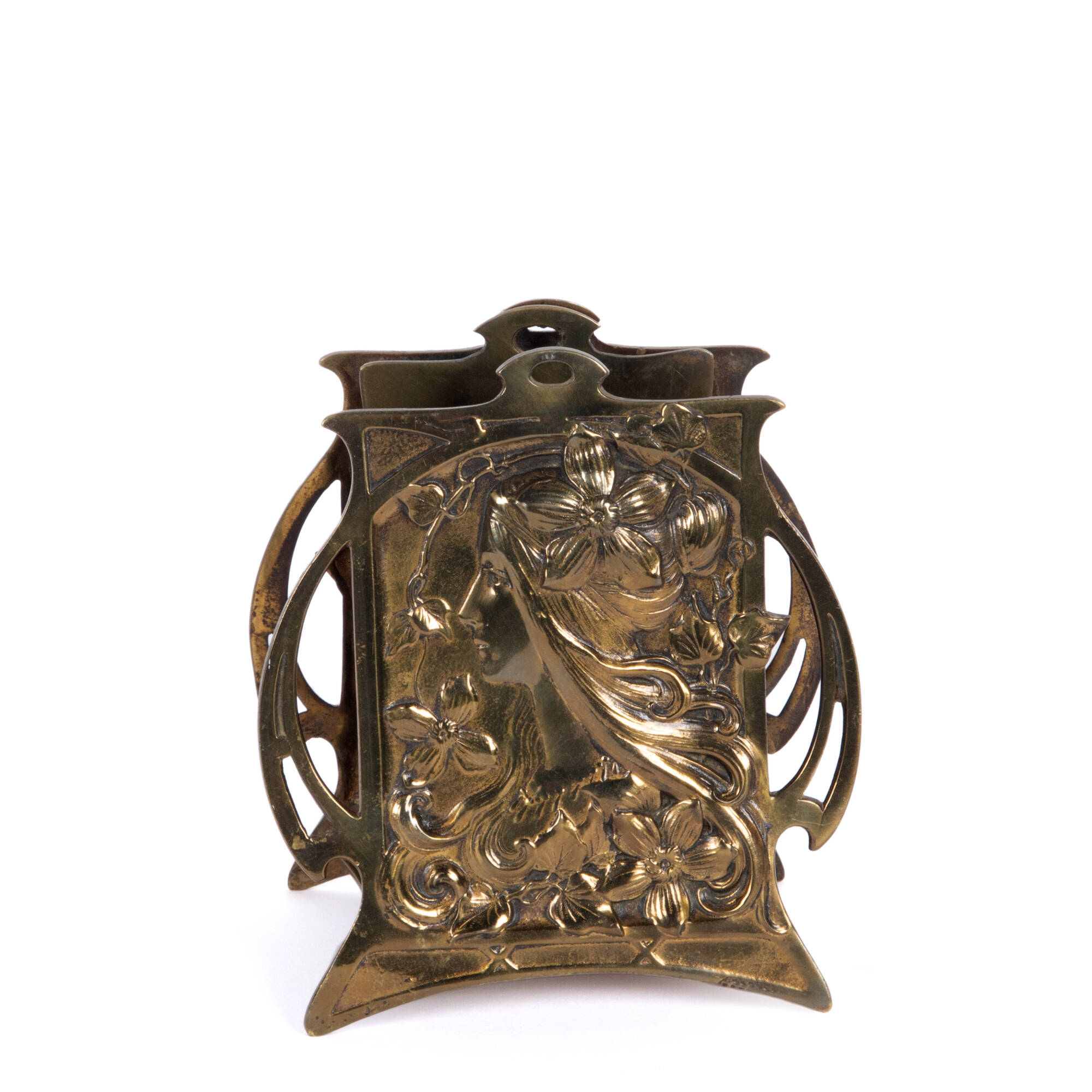 Brass letter holder with a floral motif.